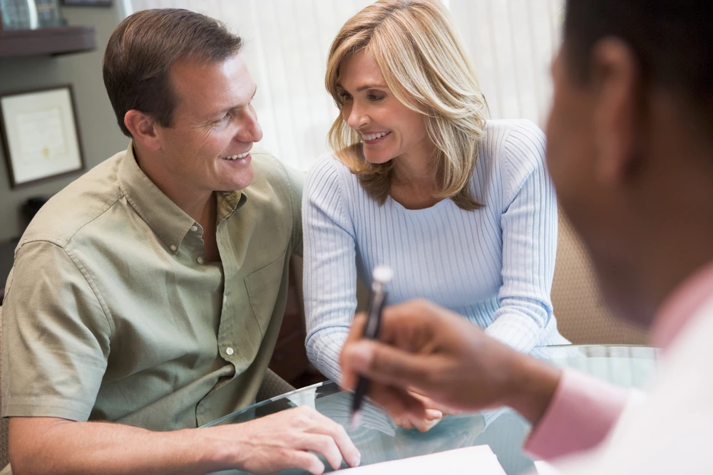 Couple in consultation at IVF clinic talking to doctor